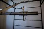 Asado Cross cooking accessory detail showing versatile positioning options