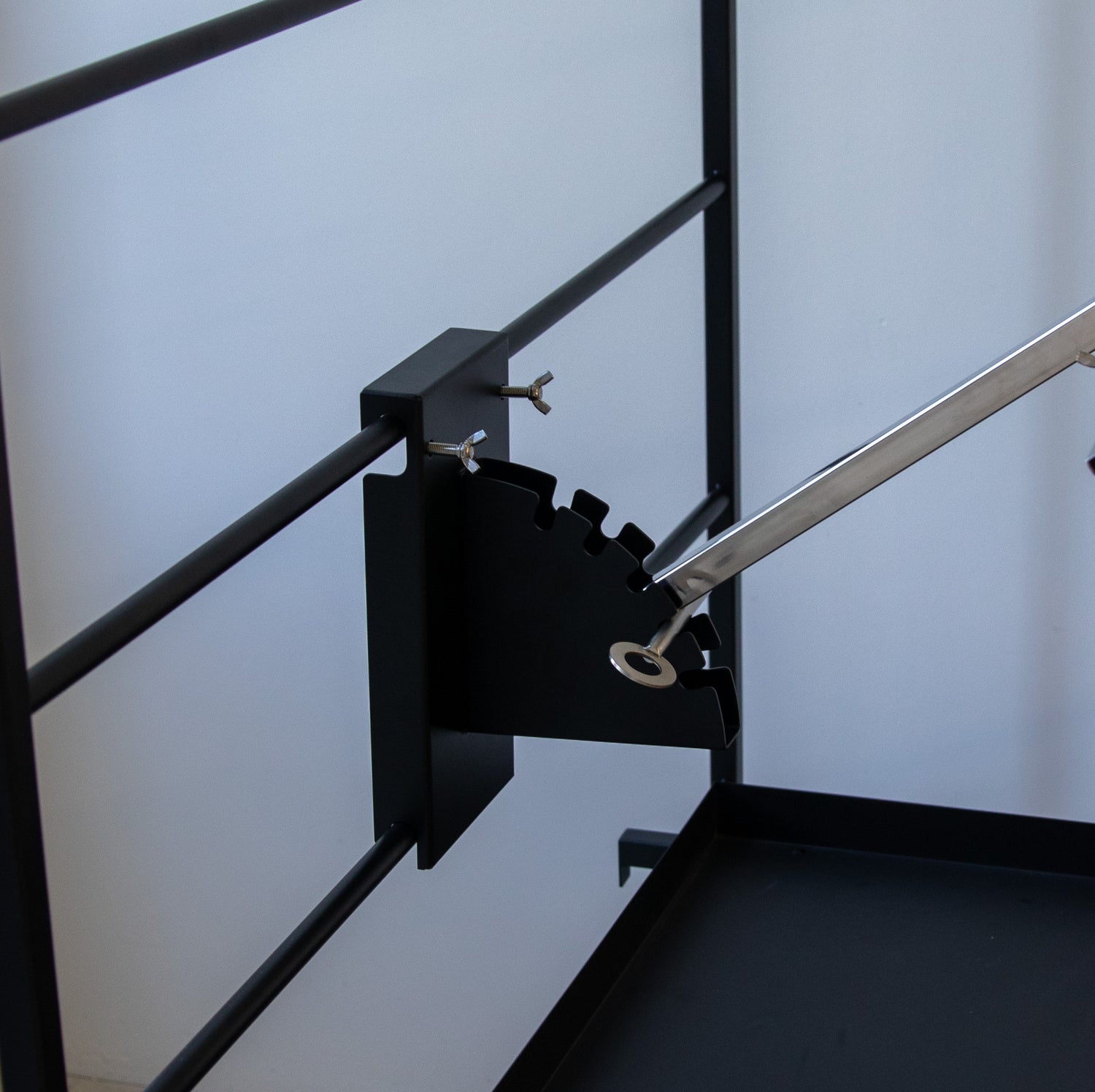 Terra Grills Asado Cross attachment showing height adjustment system