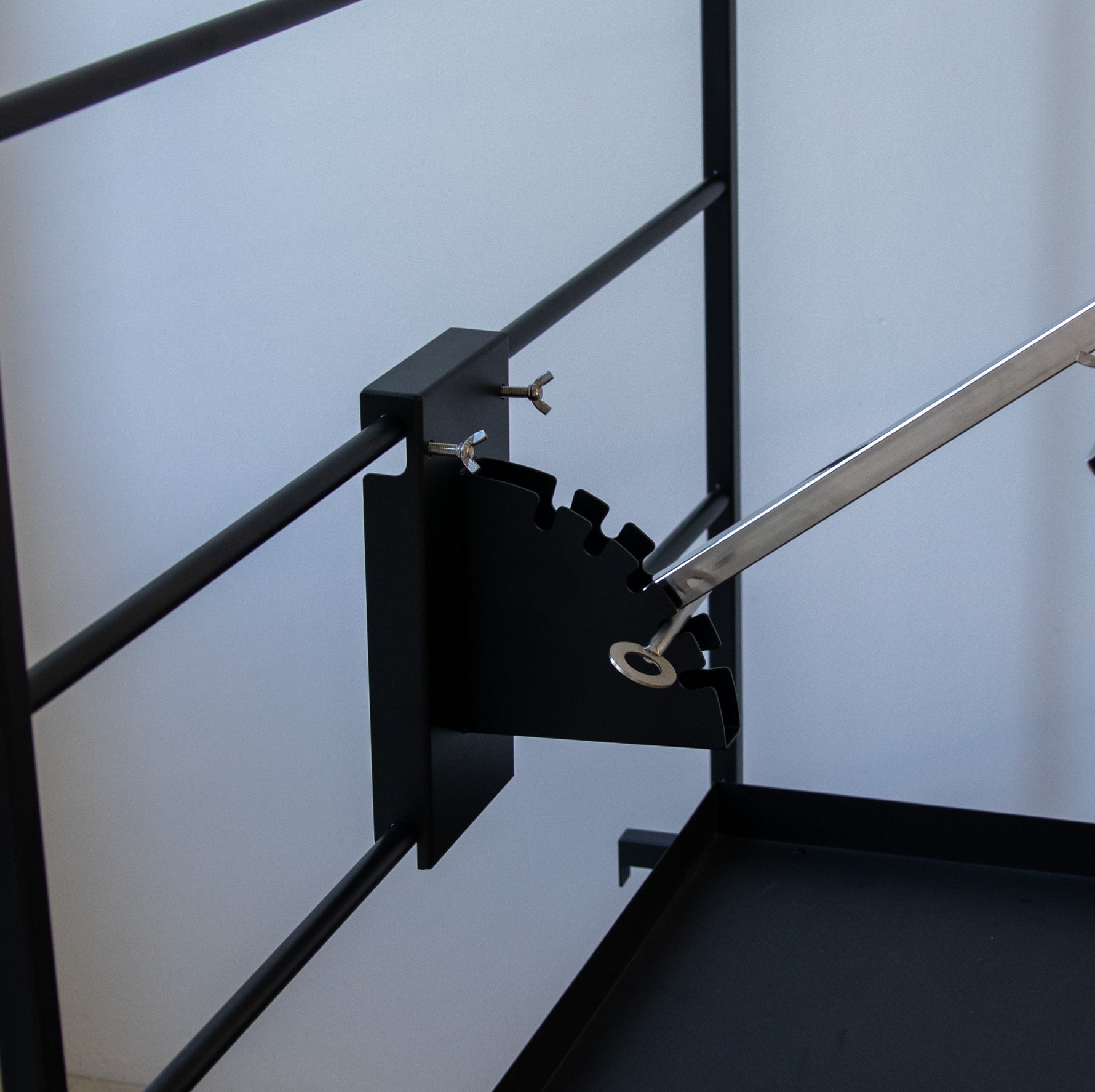Terra Grills Asado Cross attachment showing height adjustment system