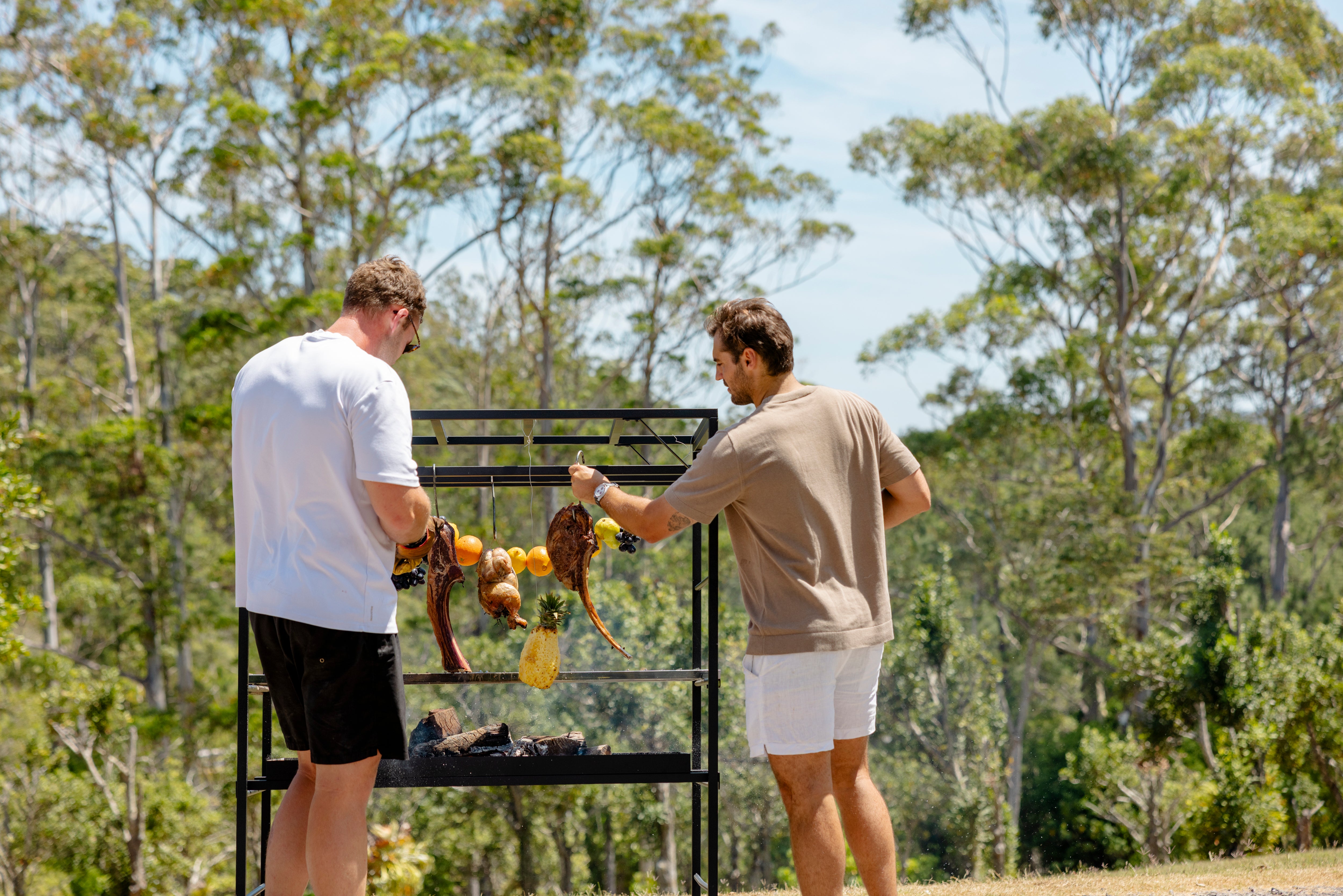 People cooking over the Portico Small outdoors